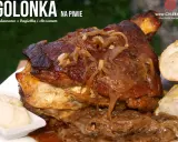 Soczysta golonka w piwie, duszona z cebulką, podana z chrzanem i bagietką. Prawdziwa uczta dla podniebienia!
