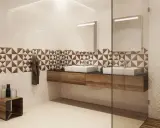 Nowoczesna łazienka z geometrycznymi płytkami, które optycznie powiększą płytki do małej łazienki.
