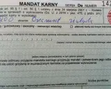 Fragment mandatu karnego z wpisaną kwotą 800 zł i podpisem.