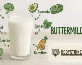 Glas Buttermilch mit Illustrationen von gesunden Lebensmitteln wie Brokkoli, Apfel, Avocado und Karotten. Ideal für buttermilch abnehmen.