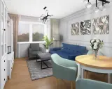 Nowoczesny salon z niebieską kanapą, szarym fotelem i okrągłym stołem. Sztukateria ścienna inspiracje dodaje elegancji.