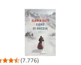 Copertina del romanzo "Fiore di roccia" di Ilaria Tuti. Una figura con un cesto in spalla cammina su un sentiero innevato, con montagne sullo sfondo.