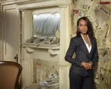 Olivia Pope in a sharp charcoal suit, embodying her iconic style. The background is a collage of newspaper clippings, hinting at the drama and intrigue of her world.