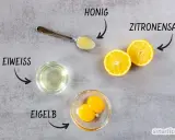 Zutaten für eine Haarkur selber machen: Eiweiß, Eigelb, Honig und Zitronensaft sind bereit.