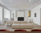 Un moderno sofá en medio del salón, con chimenea y estanterías integradas.
