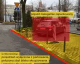 Czerwony obszar zaznacza pojazd nielegalnie zaparkowany. Ulica Morawskiego, przestrzeń wyłączona z parkowania, zbyt blisko skrzyżowania i przejścia dla pieszych.