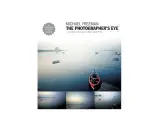 Book cover for "The Photographer's Eye" by Michael Freeman, featuring a serene seascape with boats and a lone figure in a red boat, showcasing the power of a photographer's eye.