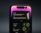 Nowy iPhone z dynamic island, wyświetlający wiadomości i pogodę.