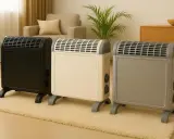 Trzy grzejniki elektryczne w kolorach czarnym, kremowym i szarym. Grzejnik v22 co to znaczy? To model, który zapewnia komfort cieplny.