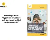 Bezpłatny e-book "Wypalenie zawodowe. Jak nie stracić siebie i swojego zespołu?". Grafika przedstawia zestresowaną kobietę w biurze, symbolizującą wypalenie zawodowe.