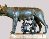 Wilczyca karmiąca Romulusa i Remusa, symboliczna scena z mitologii rzymskiej.