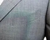 A suit jacket's breast pocket is sewn shut. This is often done to maintain the jacket's crisp silhouette, as why are pockets sewn shut is a common question for new suit owners.