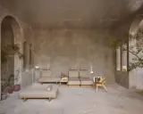 Arredamento minimalista con divani componibili e poltrona in legno. I mobili in materico significato evocano un senso di calma e naturalezza.