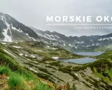 Widok na Morskie Oko i Dolinę Pięciu Stawów w Tatrach. Góry pokryte zielenią i resztkami śniegu, z krystalicznie czystymi jeziorami.