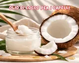 Olio di cocco per capelli: scopri le sue incredibili proprietà. Un vasetto di olio di cocco, un cocco aperto e foglie verdi.