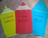Giallo, rosso e blu: i colori primari prendono vita in forme di pastelli, pronti per insegnare ai bambini.