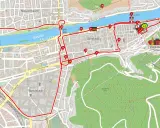 Karte mit einer roten Route, die Sehenswürdigkeiten in Heidelberg verbindet, vom Hauptbahnhof über den Neckar und das Schloss.