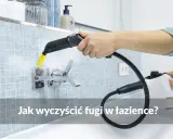 Ręczne mechaniczne czyszczenie fug parownicą Karcher. Para usuwa brud z fug przy baterii łazienkowej.