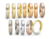 Collezione di fedi nuziali in oro giallo, oro rosso e oro rosa, con diverse finiture opache e lucide.