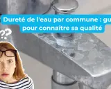 Robinet entartré, signe de dureté de l'eau. Une femme perplexe se demande quelle est la qualité de son eau.