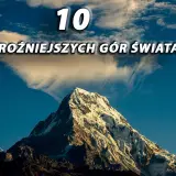 Majestatyczne szczyty, jedne z najwyższych gór świata, wznoszą się ku niebu. Chmury otulają ich ośnieżone zbocza.
