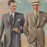 Två män i stilfulla kostymer, en med hatt, visar upp mode från 30-talet.