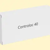 Białe pudełko z napisem Controloc 40 na jasnym, żółtym tle.