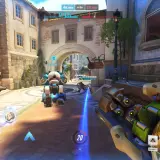 Gra Overwatch w akcji, widok z perspektywy gracza. Na ekranie widać postacie, interfejs gry i elementy otoczenia. Sprawdź wymagania Overwatch, by cieszyć się rozgrywką.