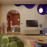 Nowoczesny salon z huśtawką, zieloną sofą i kolorowym dywanem.