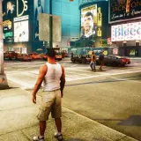 Liberty City w GTA 4 Remaster. Taksówki, neony i tłum ludzi na ruchliwym skrzyżowaniu.