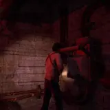 Nathan Drake w mrocznym pomieszczeniu, kontynuuje swoją uncharted pogoń za fortuną, badając mechanizm.
