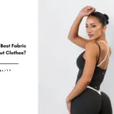 A woman models workout clothes, highlighting the importance of the right sports clothing material for comfort and performance.