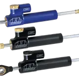 Tre ammortizzatori Hyperpro CSC, uno blu e due neri, perfetti per migliorare la stabilità delle Harley Davidson.