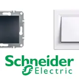 Biały przełącznik góra dół Schneider Electric obok mechanizmu montażowego.