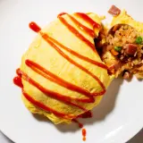 A delicious omurice, drizzled with ketchup. This dish is a popular choice for those curious about omurice calories, offering a satisfying meal.