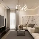 Nowoczesne oświetlenie do salonu: designerska lampa wisząca, kinkiety i taśmy LED tworzą przytulną atmosferę.