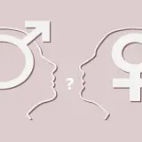 Profili stilizzati di uomo e donna si fronteggiano, un punto interrogativo tra loro. Simboli di genere e dubbi sull'identità, forse la paura di essere gay.