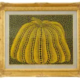 A vibrant yellow pumpkin, a signature motif of the spotted pumpkin artist, is depicted in this framed artwork. The pumpkin is covered in black dots, set against a black background with yellow netting.
