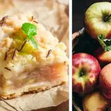 Pyszna szarlotka z airfryer, z chrupiącą kruszonką i jabłkami, obok świeżych jabłek w koszyku.