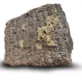 Ett stycke porös sten med mörkgrå och gulaktiga partier. Dess blåbetong utseende ger en känsla av naturlig textur.