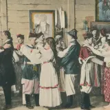 Scena weselna w stylu Wyspiańskiego. Ludzie w strojach ludowych tańczą, a na ścianach wiszą obrazy.