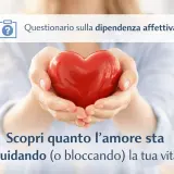 Mani che sorreggono un cuore rosso, simbolo di amore. Un invito a scoprire se si tende a pensare di non meritare amore, esplorando la dipendenza affettiva.