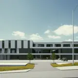 Nowoczesny budynek Zachodniopomorskiego Centrum Medyczne z parkingiem i zielenią.