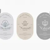 Trzy etykiety produktów organicznych: "Beauty", "Nature" i "Valera". Każda zawiera logo, slogan i listę składników, podkreślając naturalne pochodzenie i wysoką jakość.