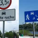 Znak "Strefa ruchu" z ikoną samochodu i znak niebieski z piktogramami ruchu drogowego i pieszych.