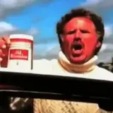 Will Ferrell med solbränd hy och vit polotröja håller upp en burk Old Spice.