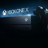 Konsola Xbox One X i kontroler na ciemnym tle. Gotowi na epicką rozgrywkę?