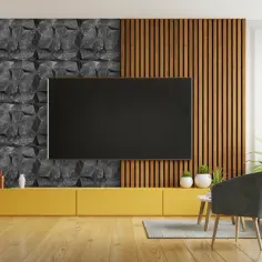 Nowoczesne panele ścienne na korytarzu: geometryczny wzór kamienia i pionowe drewniane listwy tworzą stylowe tło dla telewizora.