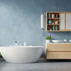 Nowoczesna łazienka z wolnostojącą wanną i drewnianą szafką z umywalkami. Szukasz pomysłu co zamiast płytek do łazienki? Zobacz tę inspirację!