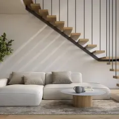 Nowoczesne schody w salonie z drewnianymi stopniami i metalową balustradą, obok wygodnej sofy i rośliny.